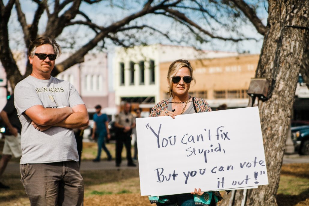 woman encouraging people to vote - climate change