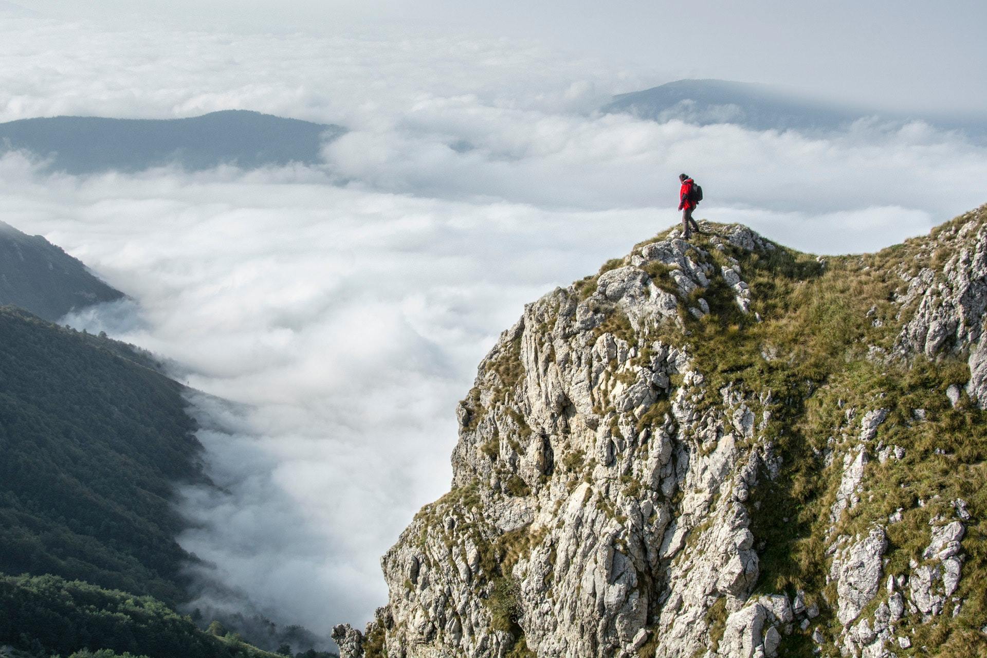 men standing on the top of a mountain - goal achieved