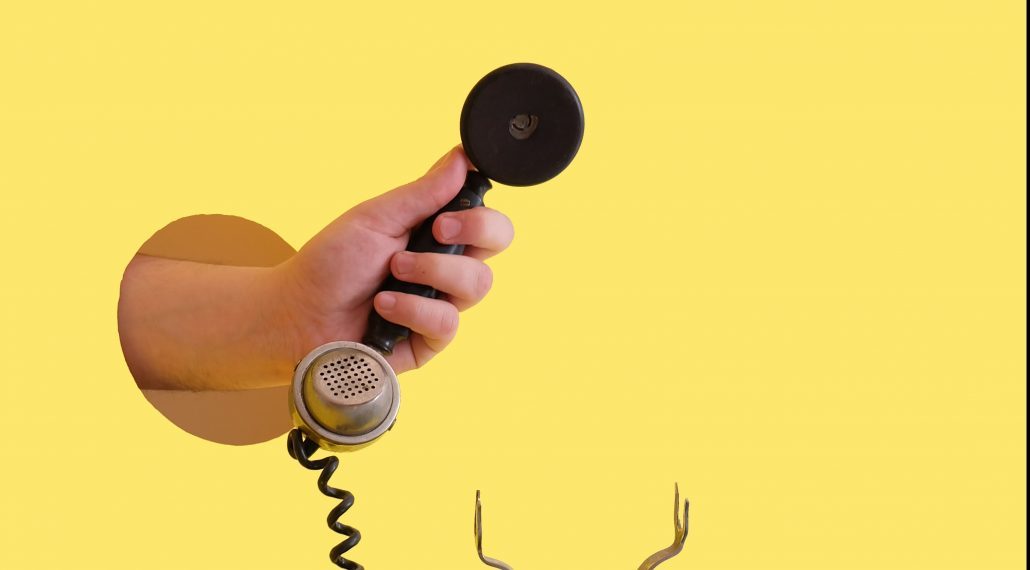 hand holding a vintagee phone - communication