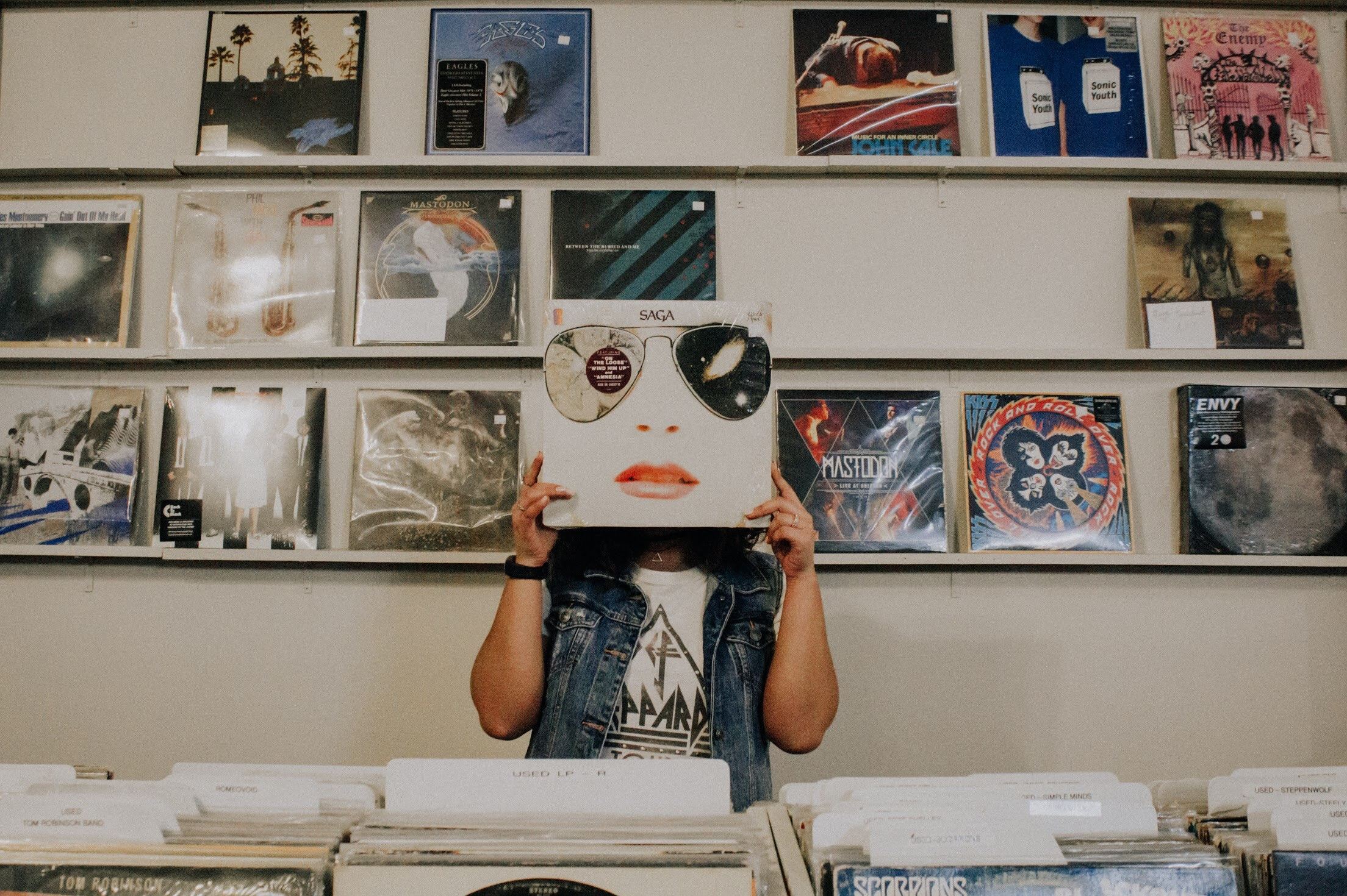 introvert girl holding a disco in front of her face