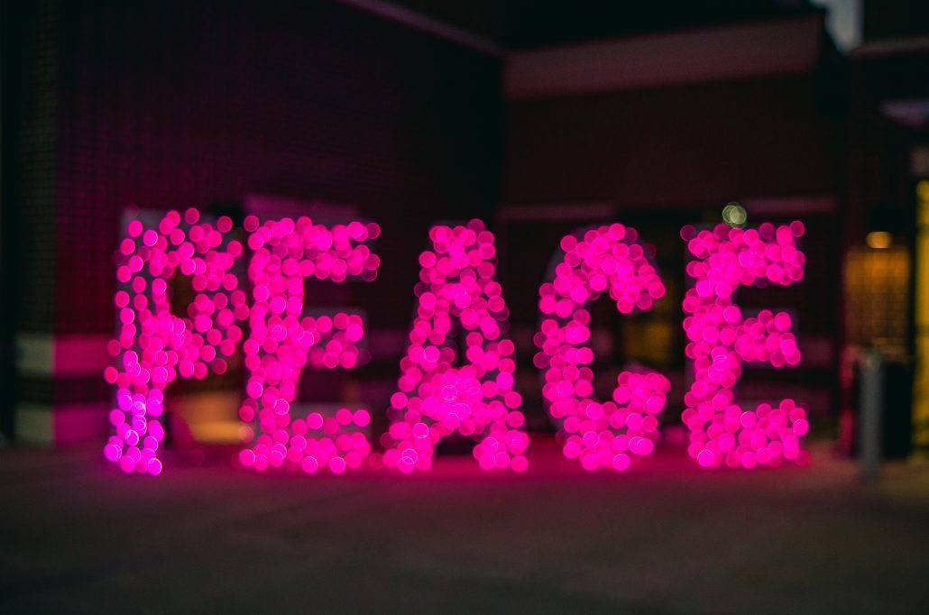Peace written in a colorful light
