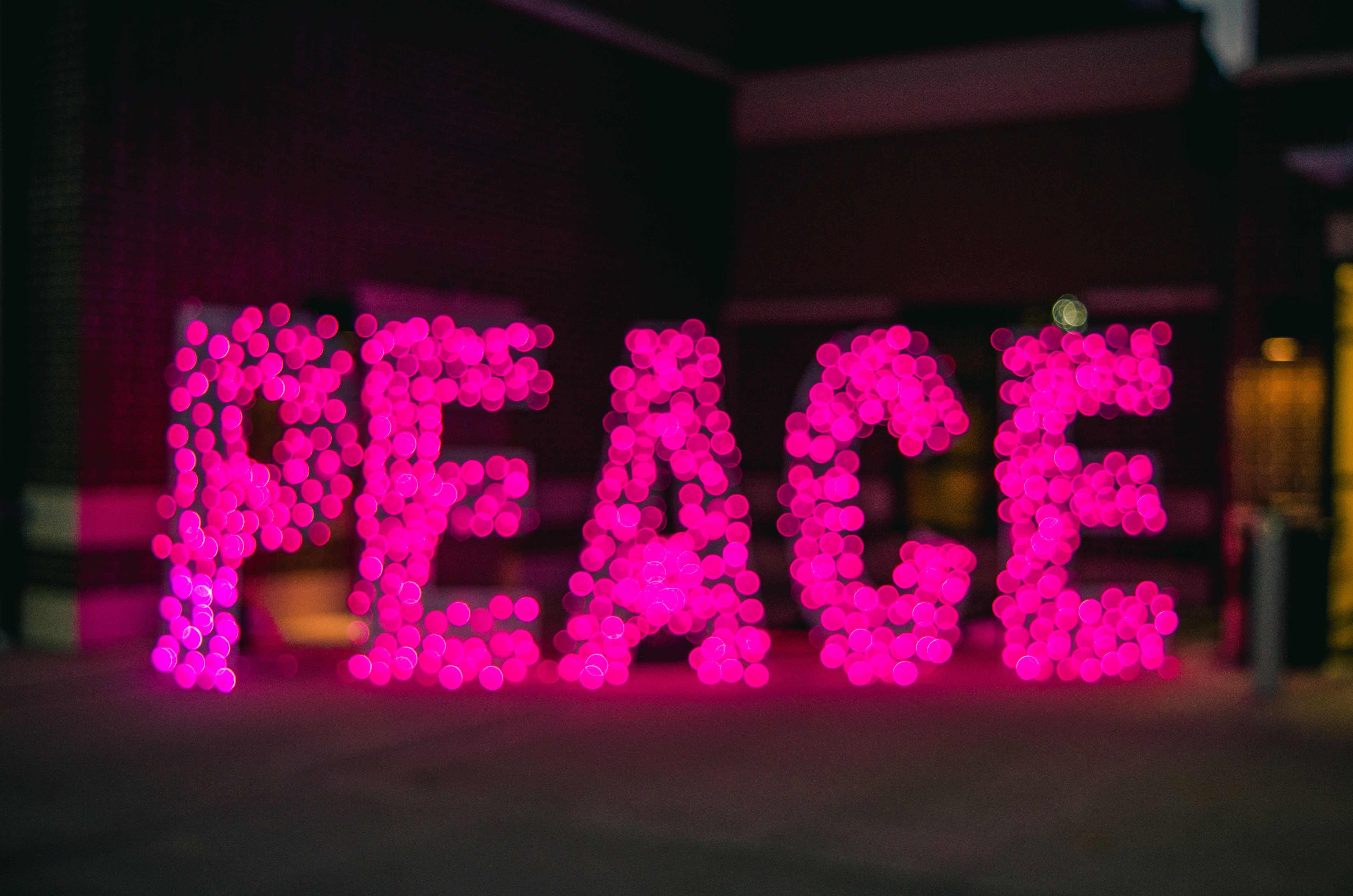 Peace written in a colorful light
